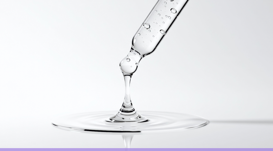     Clear skincare serum dripping from a glass dropper for a Two Sisters Ko blog about PDRN skincare